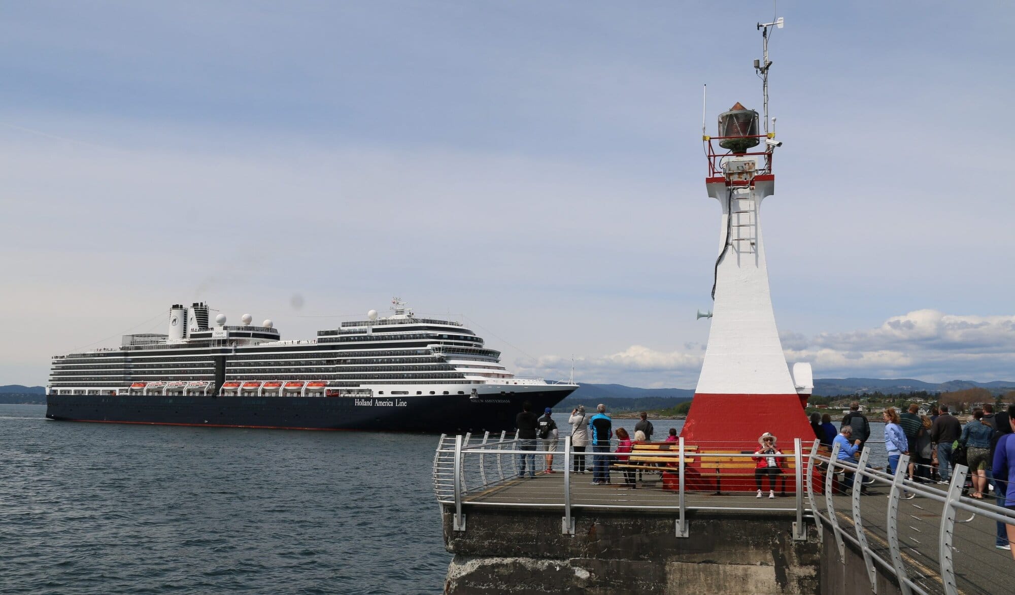 Holland America's Nieuw Amsterdam cruise ship passing the Breakwater lighthouse.